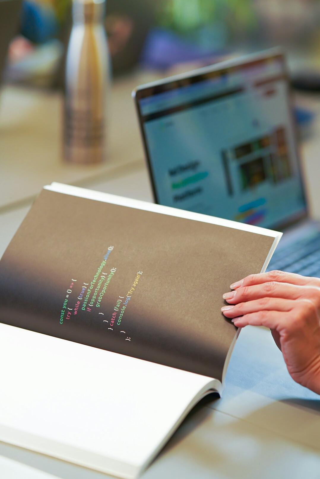 person coding on laptop