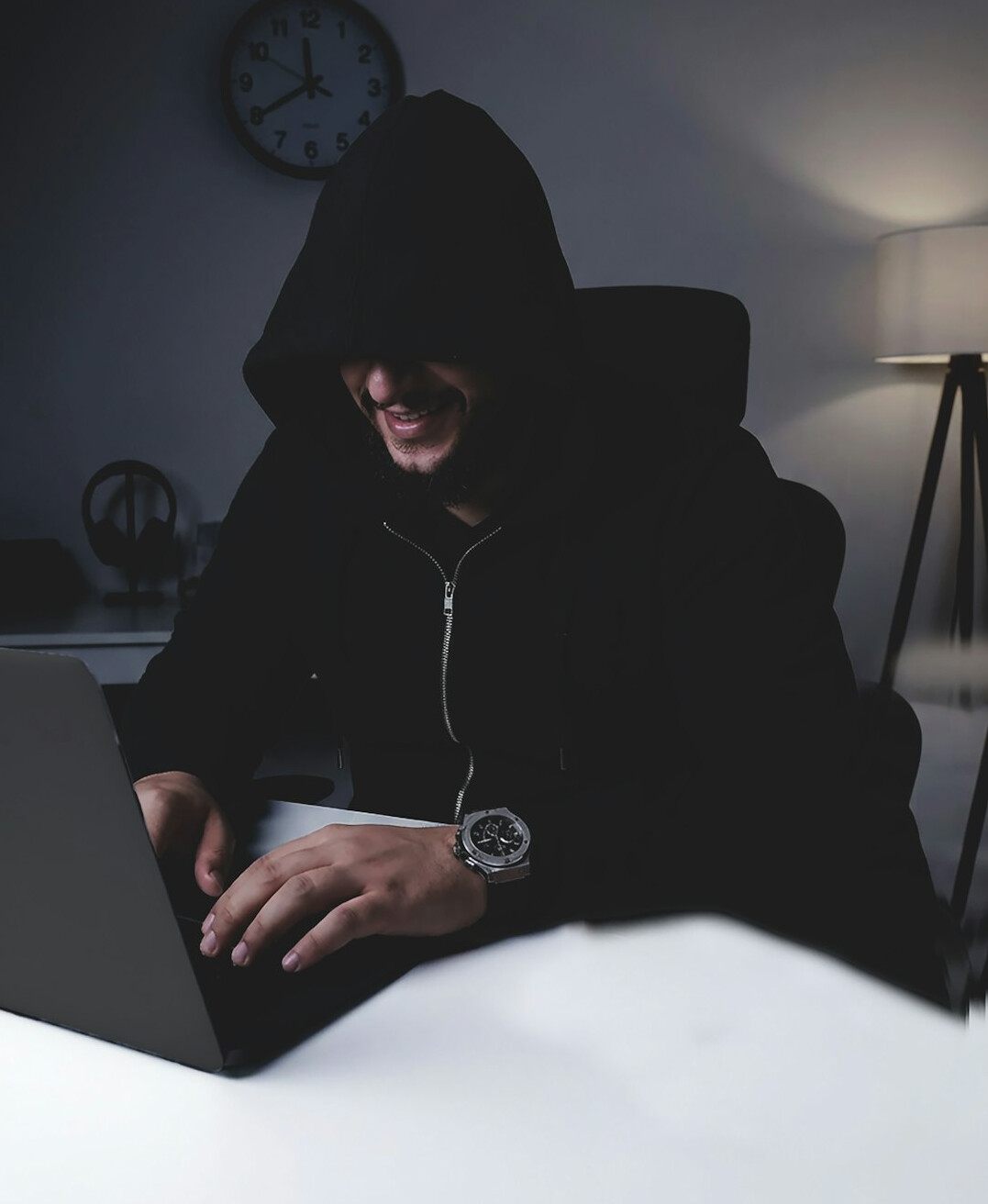 programmer typing code on laptop