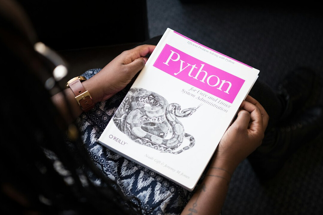 student reading programming book